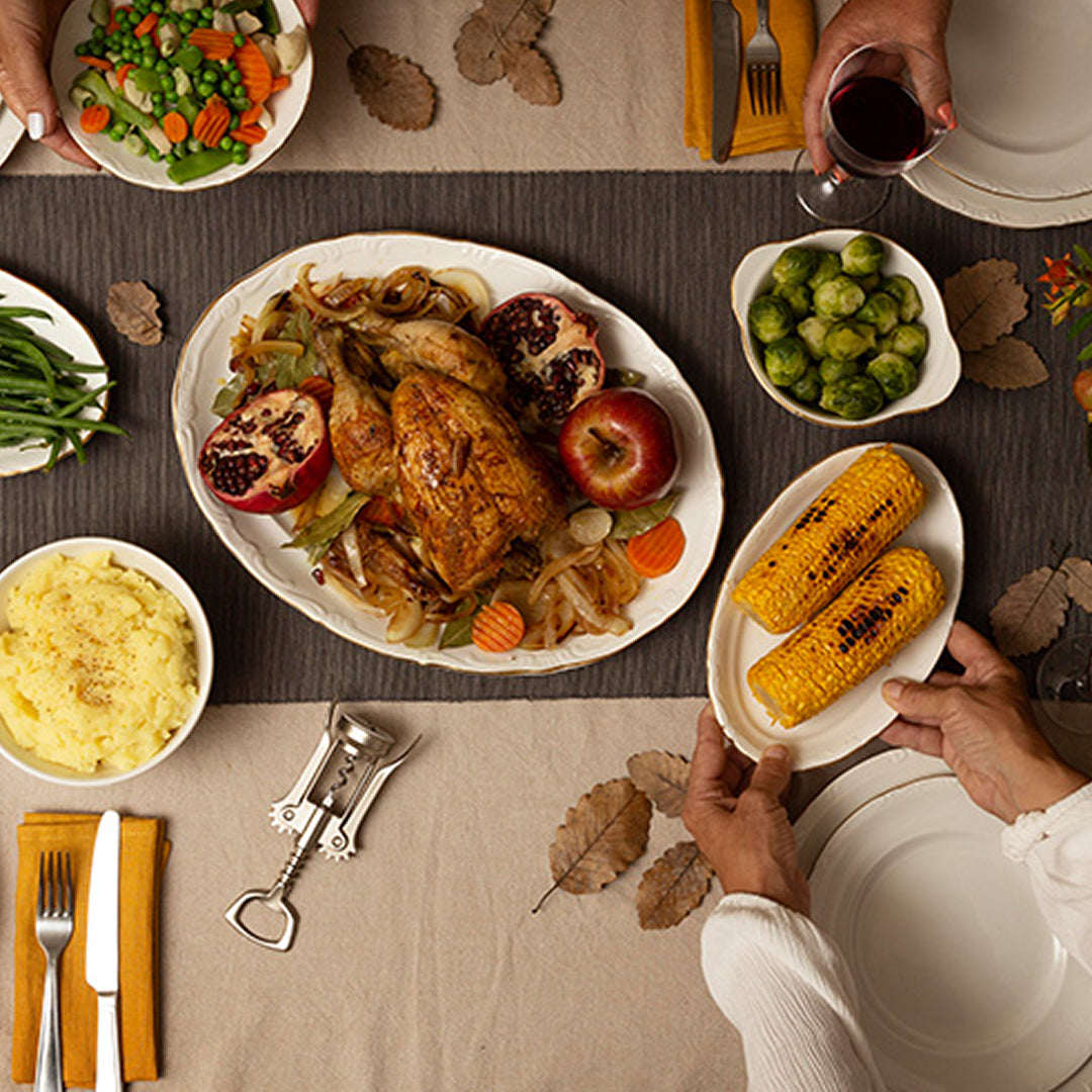 Overhead shot of a festive holiday dinner table setting.