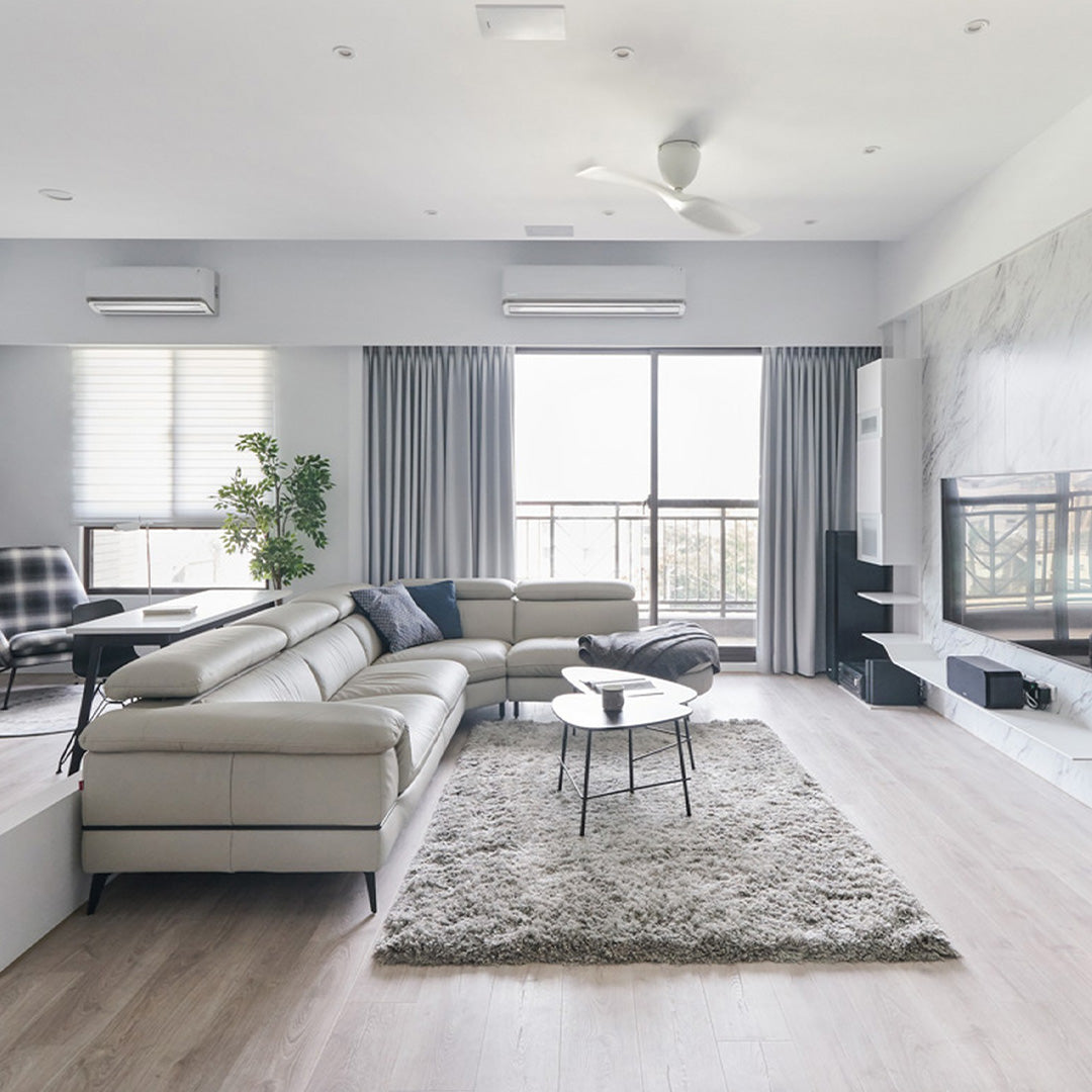 Spacious modern living room with neutral tones, natural light