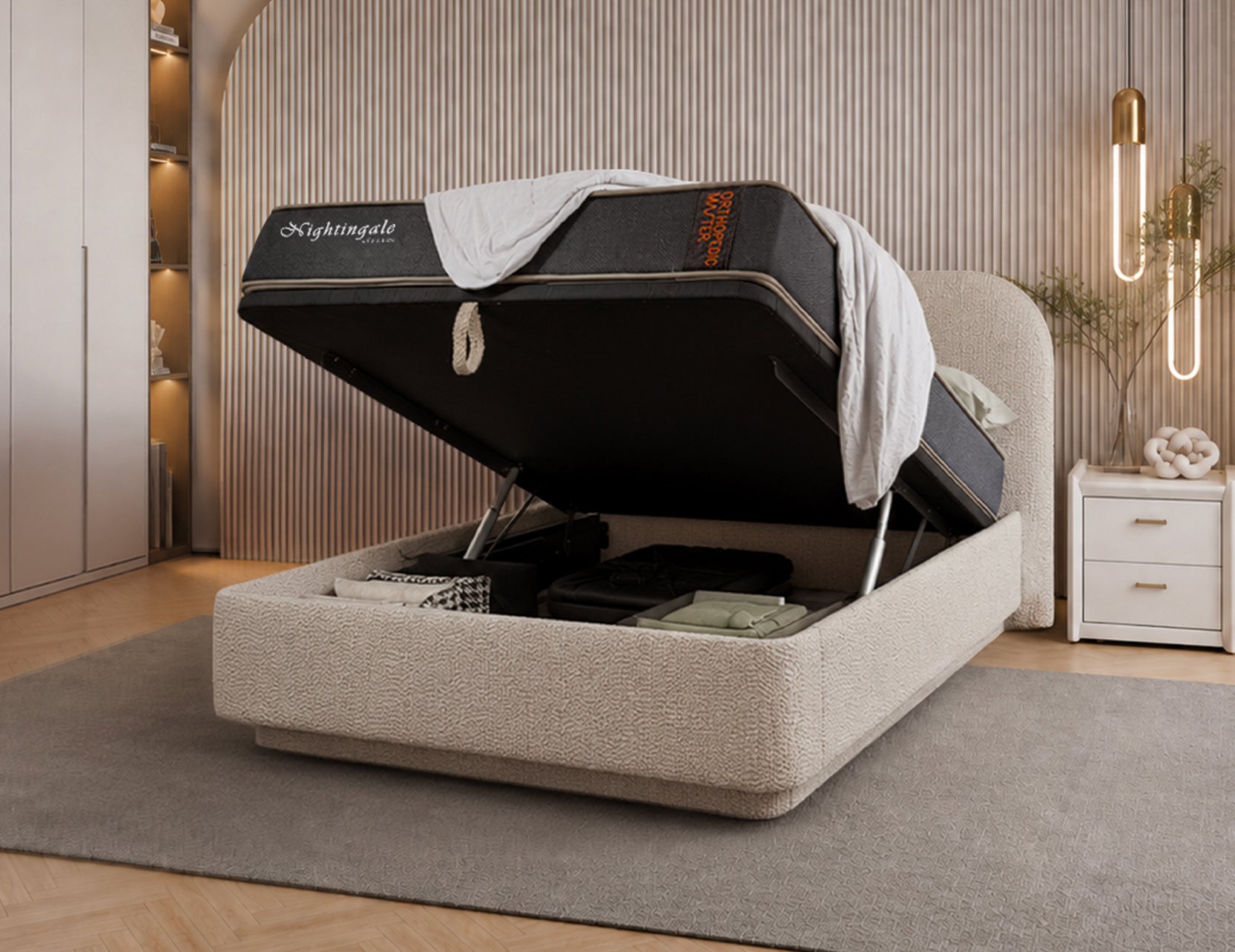 Storage frame with hydraulic lift mechanism raised open, showing underbed storage space and Nightingale mattress
