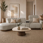 Cellini cream leather sectional sofa with curved ottoman and power recliner in a warm minimalist living room
