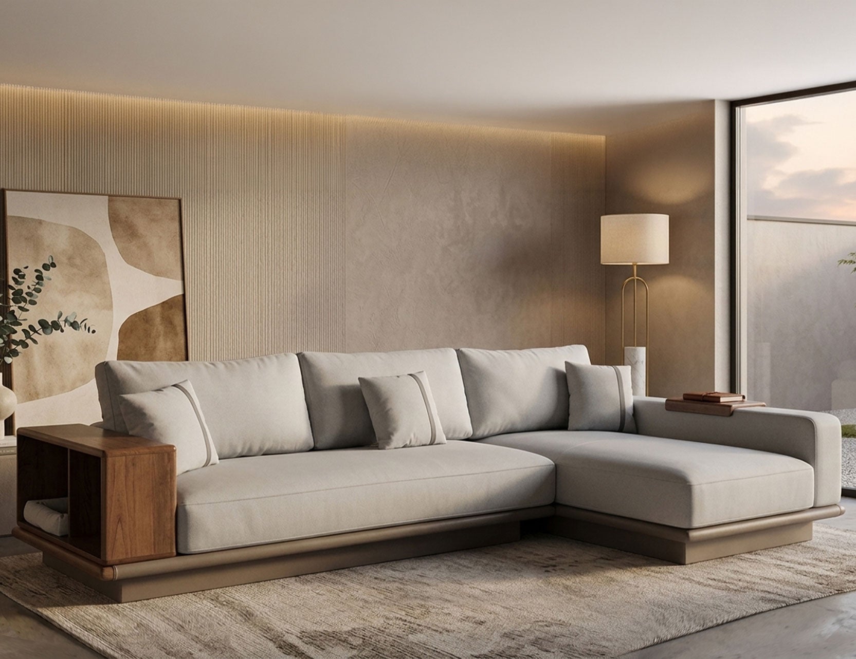 L-shaped sectional sofa in light grey fabric with walnut wood armrest shelf and brushed gold base, styled in a warm Japandi living room